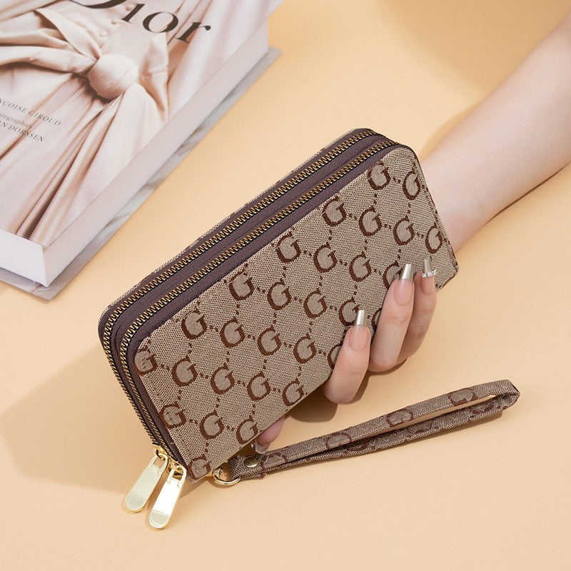 GESSY LOGO PRINT RETRO CLUTCH BAG