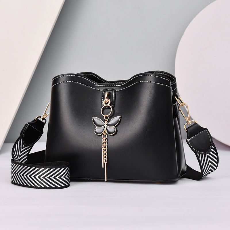 GESSY BUTTERFLY TASSEL DECOR MAGNETIC SNAP CROSSBODY BAG IN BLACK