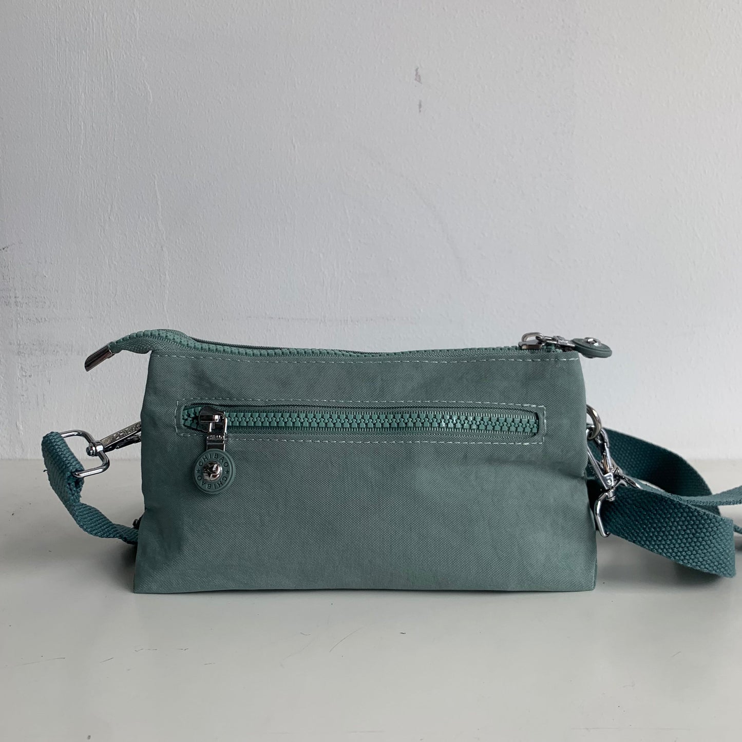 GESSY SMALL NYLON CLUTCH CROSSBODY BAG IN GREEN