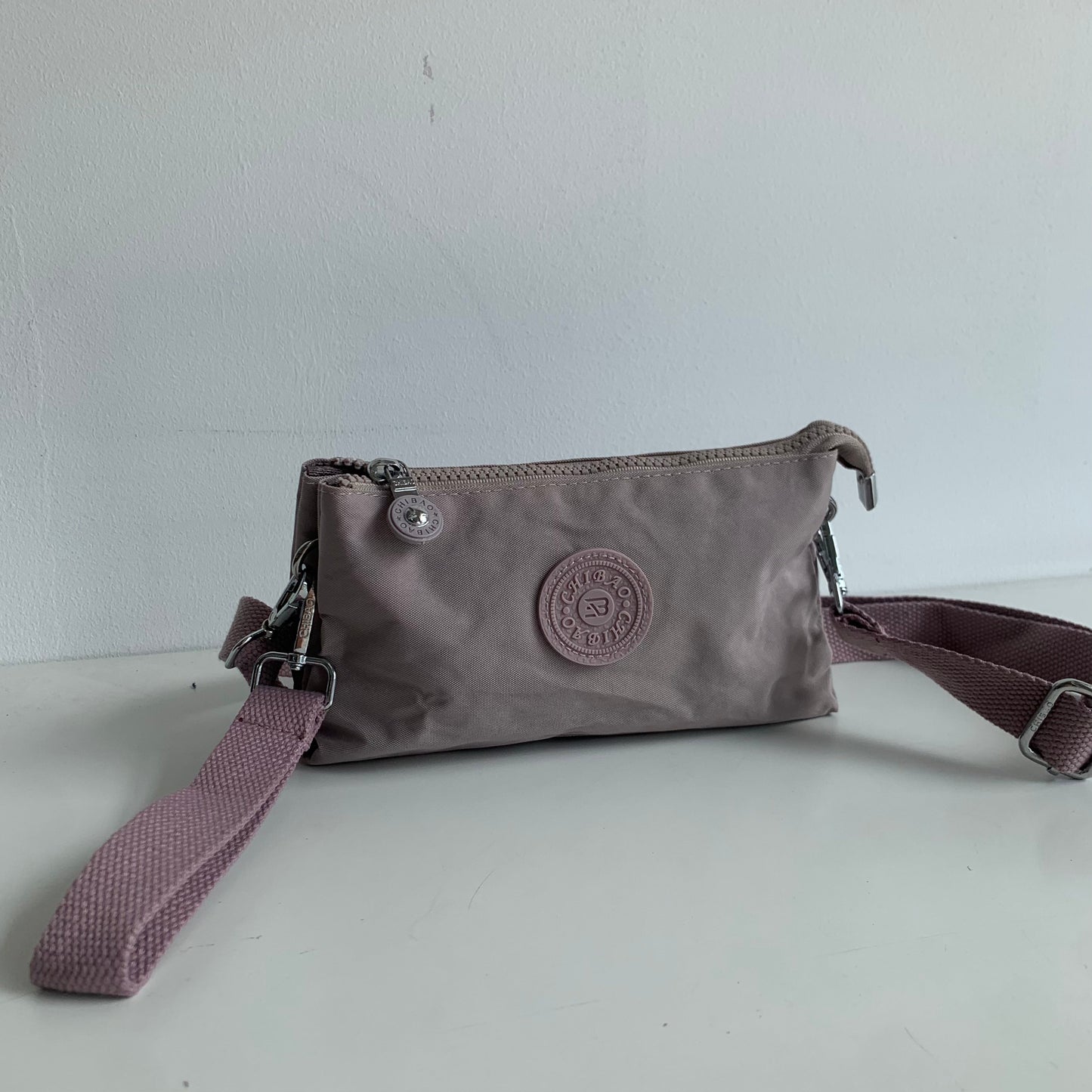 GESSY SMALL NYLON CLUTCH CROSSBODY BAG IN PINK