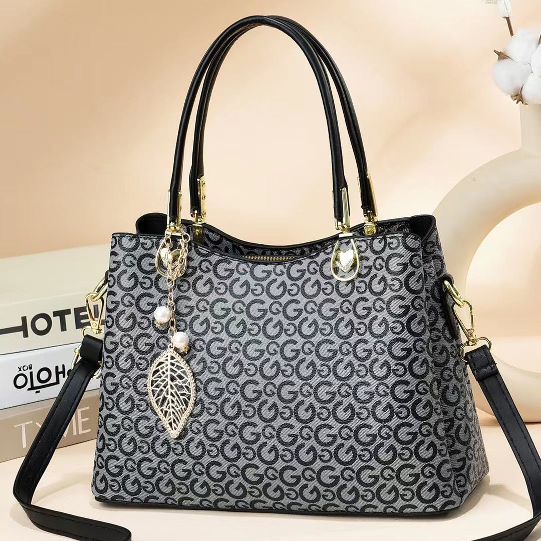 GESSY LOGO PRINT HANDBAG TOTE BAG IN GREY WITH LEAF PAD
