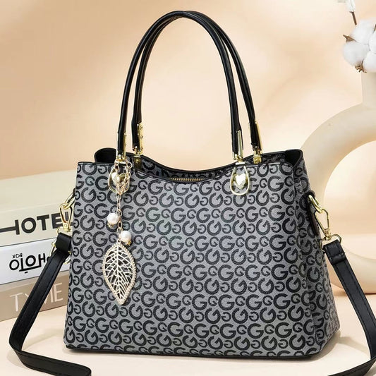 GESSY LOGO PRINT HANDBAG TOTE BAG IN GREY WITH LEAF PAD