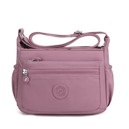 GESSY NYLON FRONT ZIP MULTI-LAYER CROSSBODY BAG IN PINK