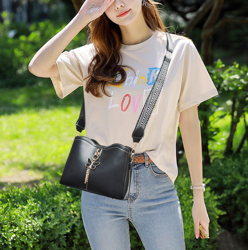 GESSY BUTTERFLY TASSEL DECOR MAGNETIC SNAP CROSSBODY BAG IN BLACK