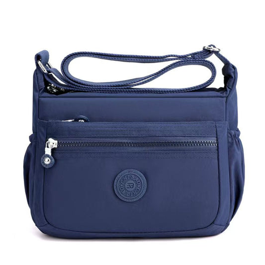 GESSY NYLON FRONT ZIP MULTI-LAYER CROSSBODY BAG IN BLUE