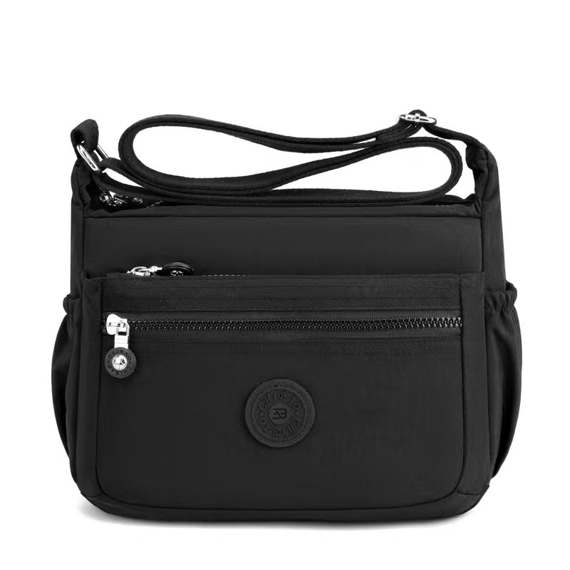 GESSY NYLON FRONT ZIP MULTI-LAYER CROSSBODY BAG IN BLACK