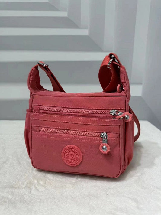 GESSY MULTIFUCTIONAL BAG IN CORAL
