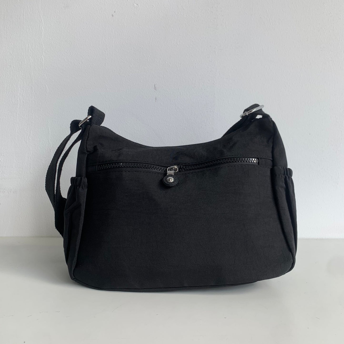 GESSY FRONT TRIPLE ZIP NYLON CROSSBODY BAG IN BLACK