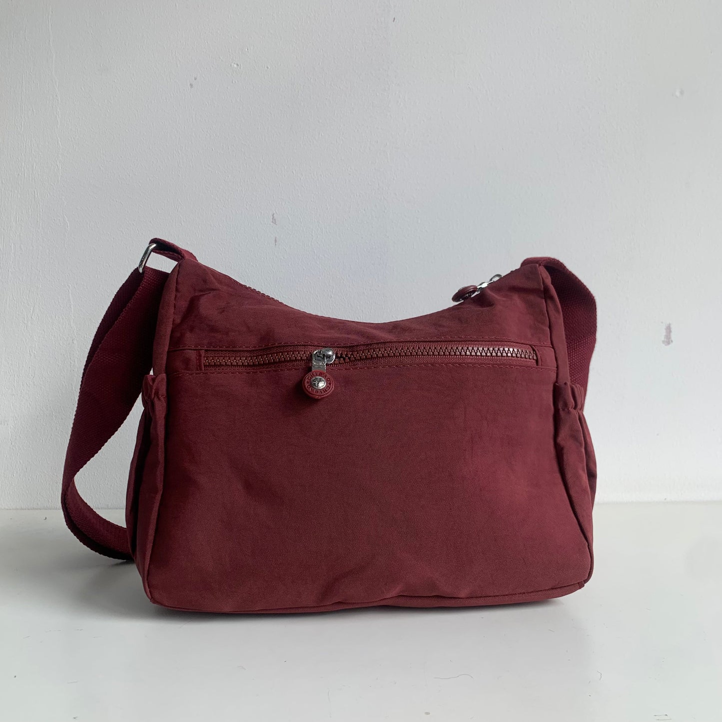 GESSY FRONT TRIPLE ZIP NYLON CROSSBODY BAG IN RED