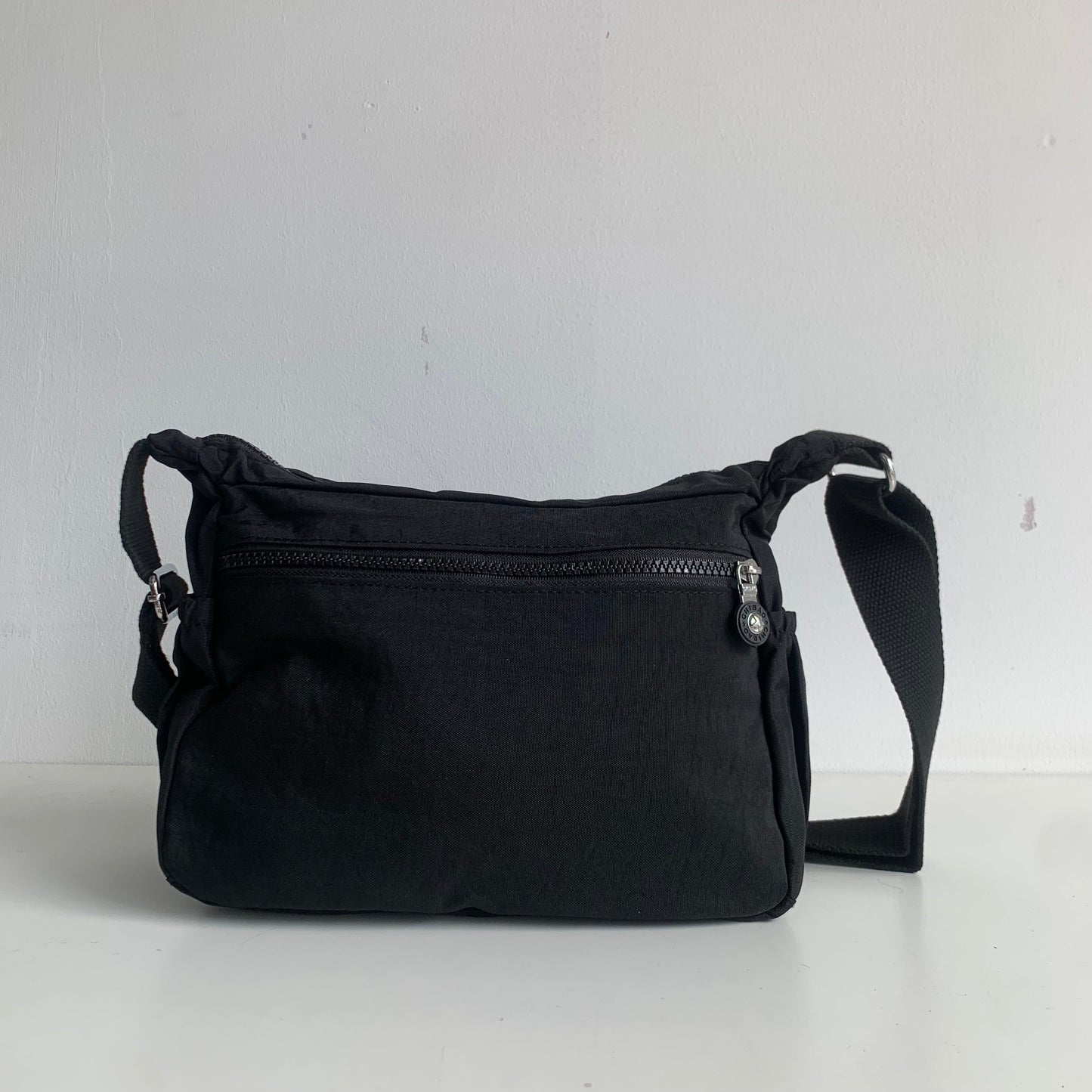 GESSY NYLON FRONT ZIP MULTI-LAYER CROSSBODY BAG IN BLACK