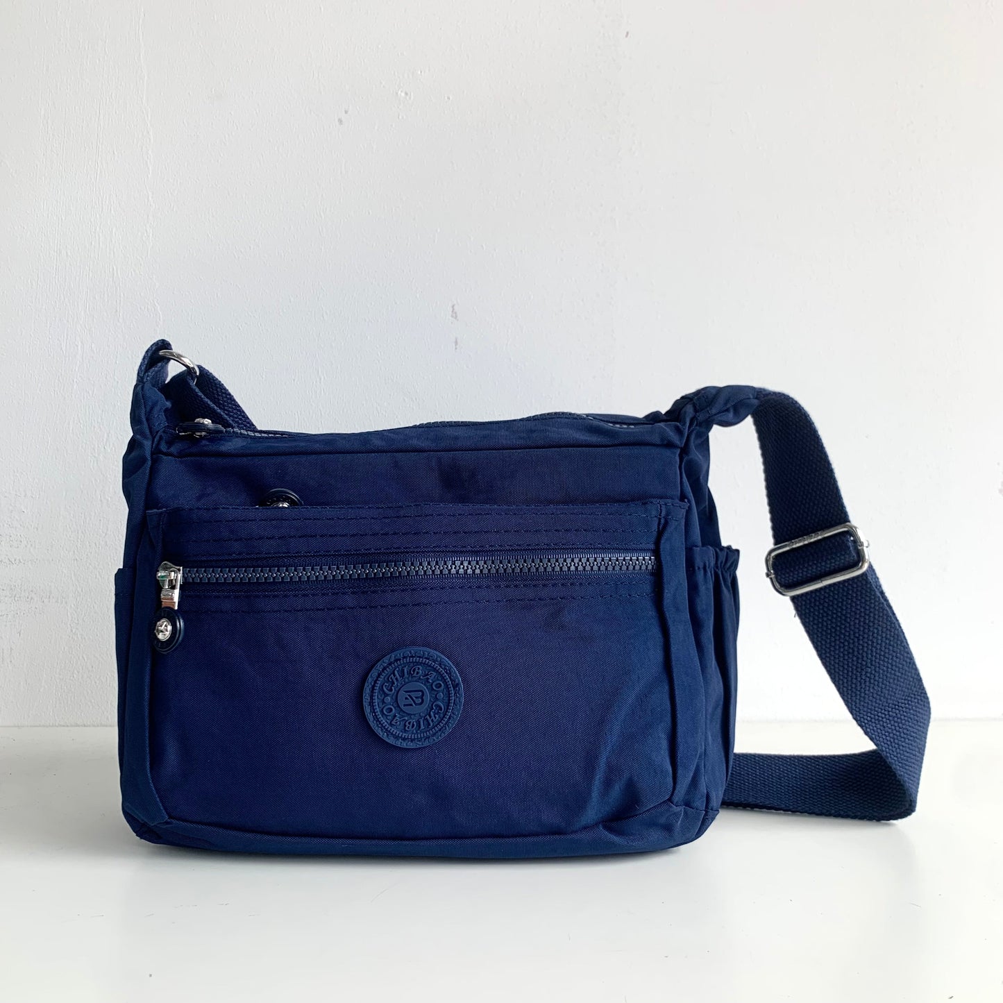 GESSY NYLON FRONT ZIP MULTI-LAYER CROSSBODY BAG IN BLUE