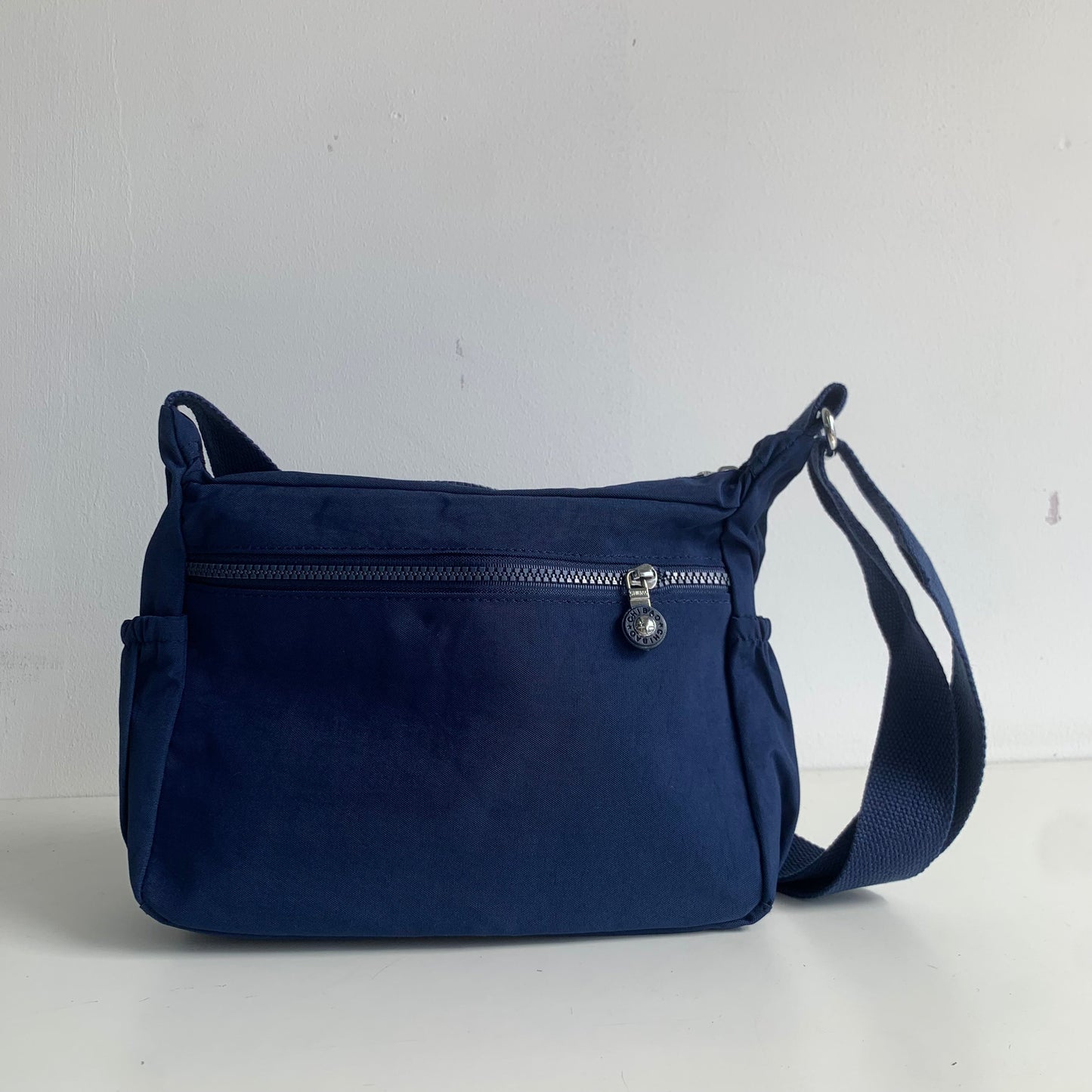 GESSY NYLON FRONT ZIP MULTI-LAYER CROSSBODY BAG IN BLUE