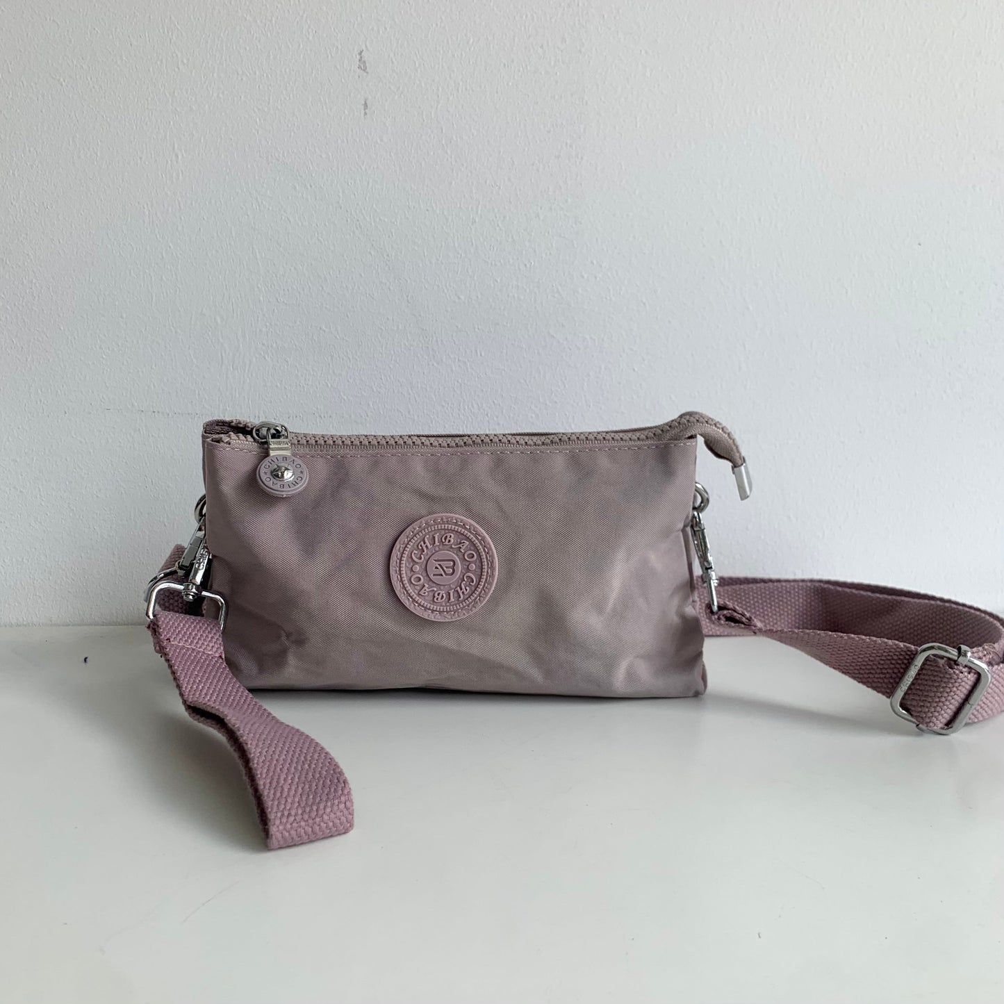 GESSY SMALL NYLON CLUTCH CROSSBODY BAG IN PINK