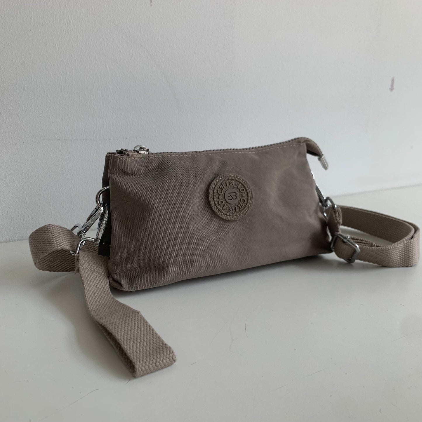 GESSY SMALL NYLON CLUTCH CROSSBODY BAG IN PINK