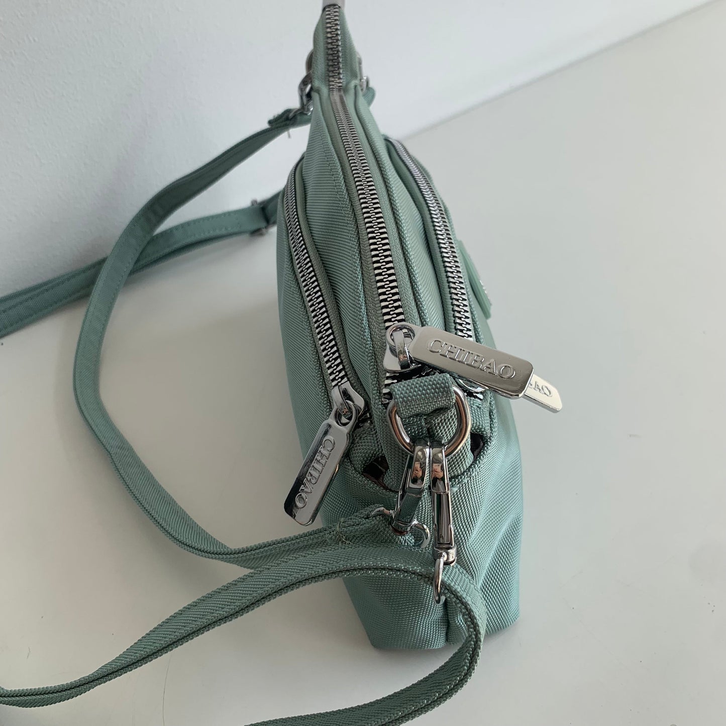 GESSY MULTI-LAYER CROSSBODY BAG IN GREEN