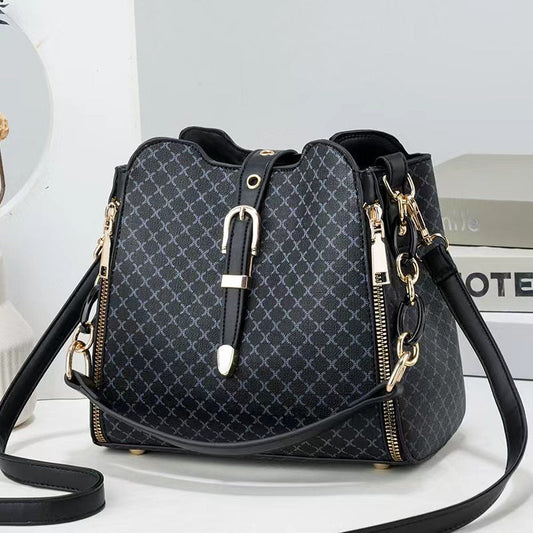GESSY RETRO MESH PRINT METAL SNAP BUCKET BAG IN BLACK
