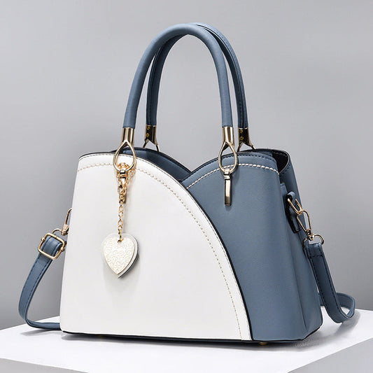 GESSY COLORBLOCK HEART SHAPE BAG IN BLUE