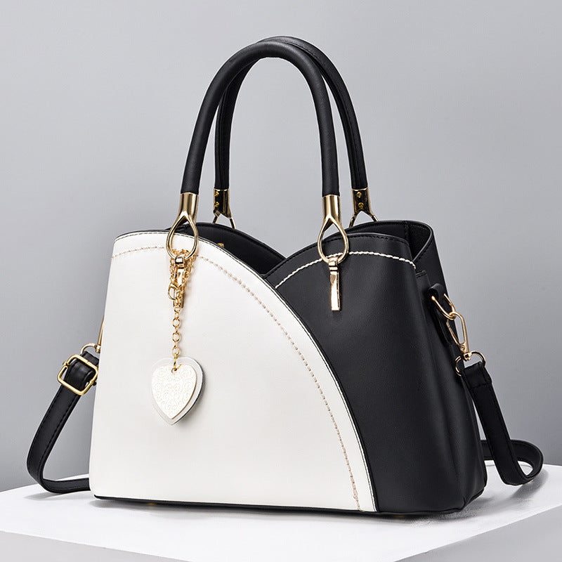 GESSY COLORBLOCK HEART SHAPE BAG IN BLACK