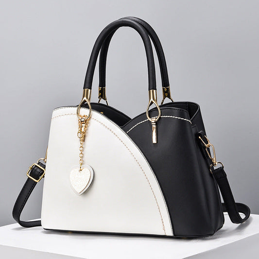 GESSY COLORBLOCK HEART SHAPE BAG IN BLACK