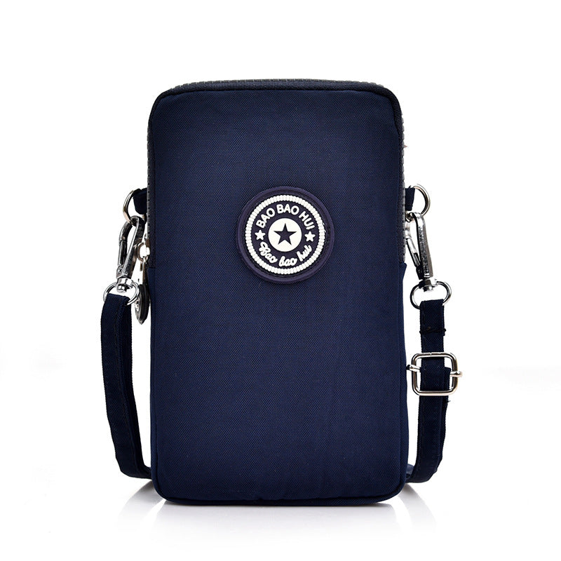 GESSY CROSS BODY PHONE BAG IN BLACK NAVY AND PINK