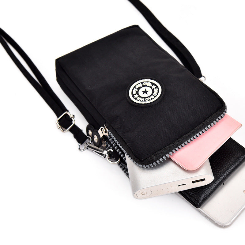 GESSY CROSS BODY PHONE BAG IN BLACK NAVY AND PINK