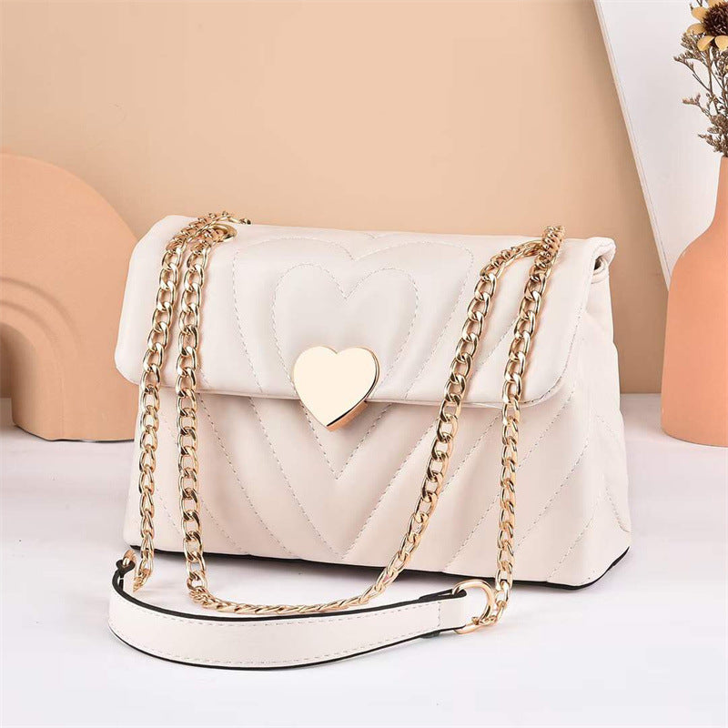 GESSY CROSSBODY FLAP BAG WITH HEART PATTERN