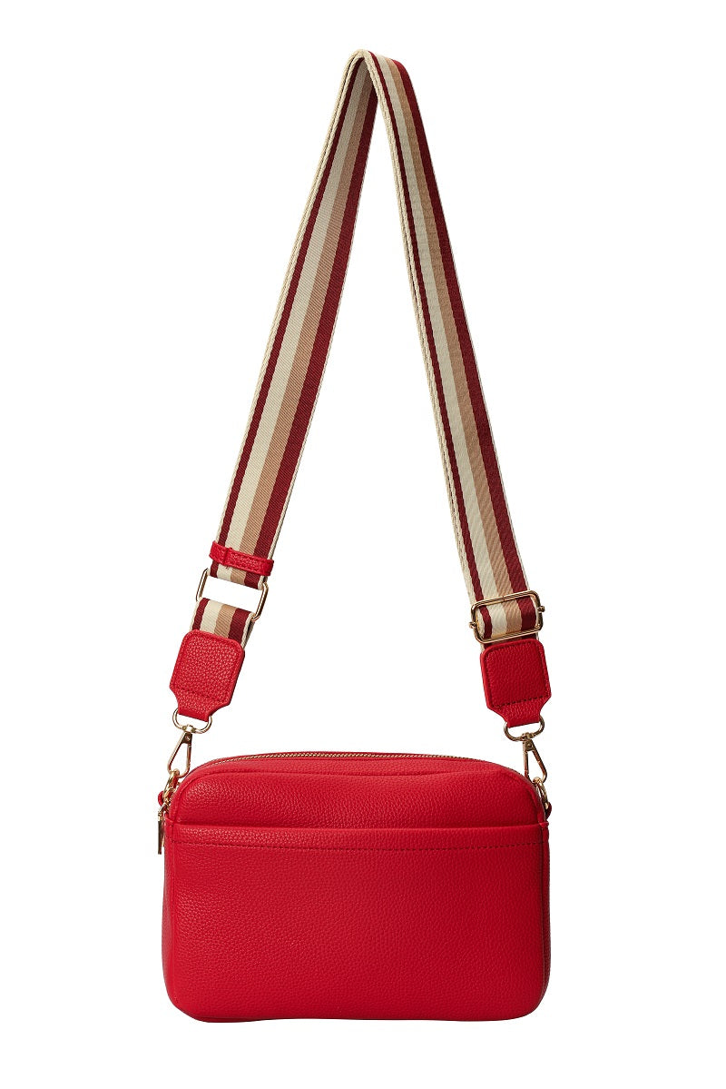 GESSY SOLID COLOR CROSSBODY BAG IN RED WITH STRIP PATTERNED STRAP