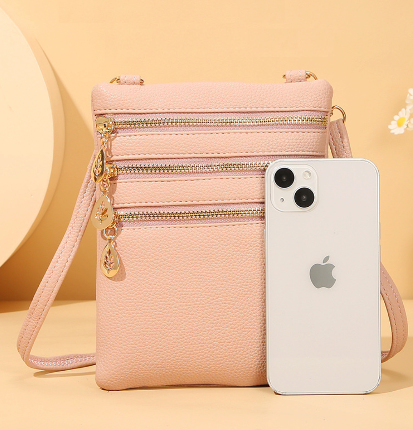 GESSY TRIPLE ZIP SMALL CROSSBODY BAG IN PINK