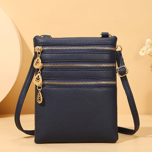 GESSY TRIPLE ZIP SMALL CROSSBODY BAG IN BLUE
