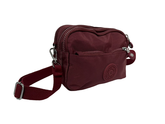 GESSY NYLON SMALL ZIP-LOCK CROSSBODY BAG IN WINE